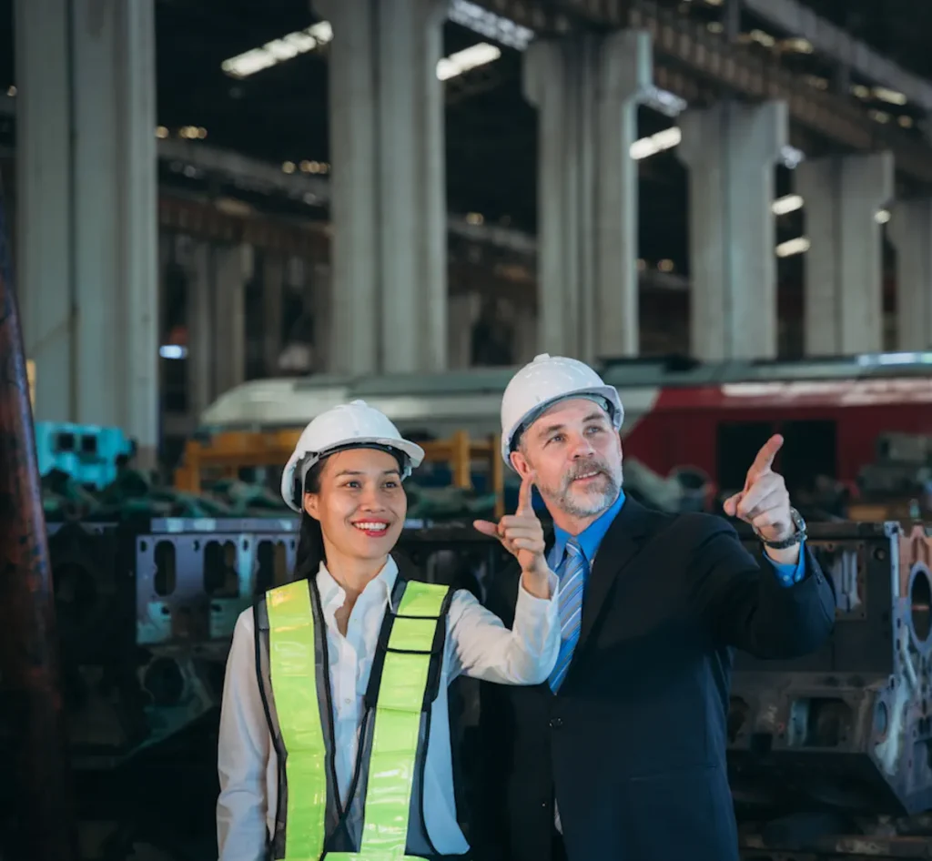 Successful Equipment Refinancing a man and a woman express a high level of confidence at the railway garage